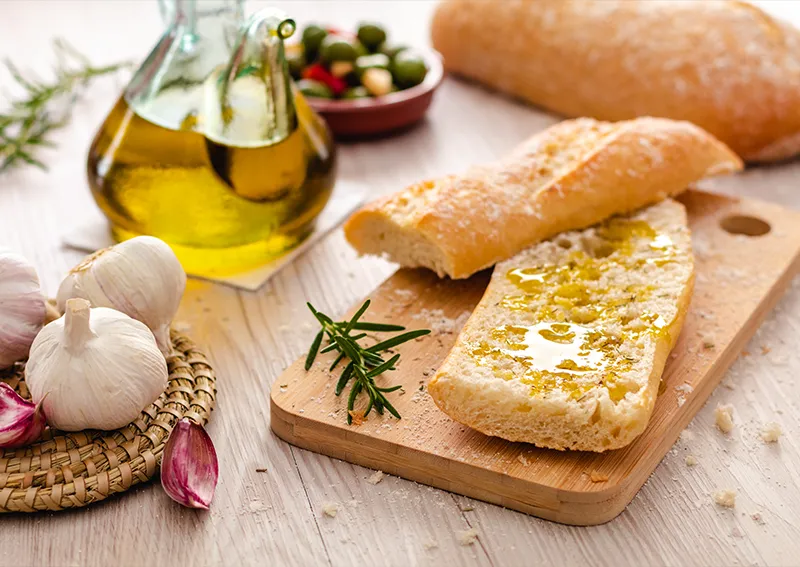 image of bread wwith olive oil, garlic and decoration